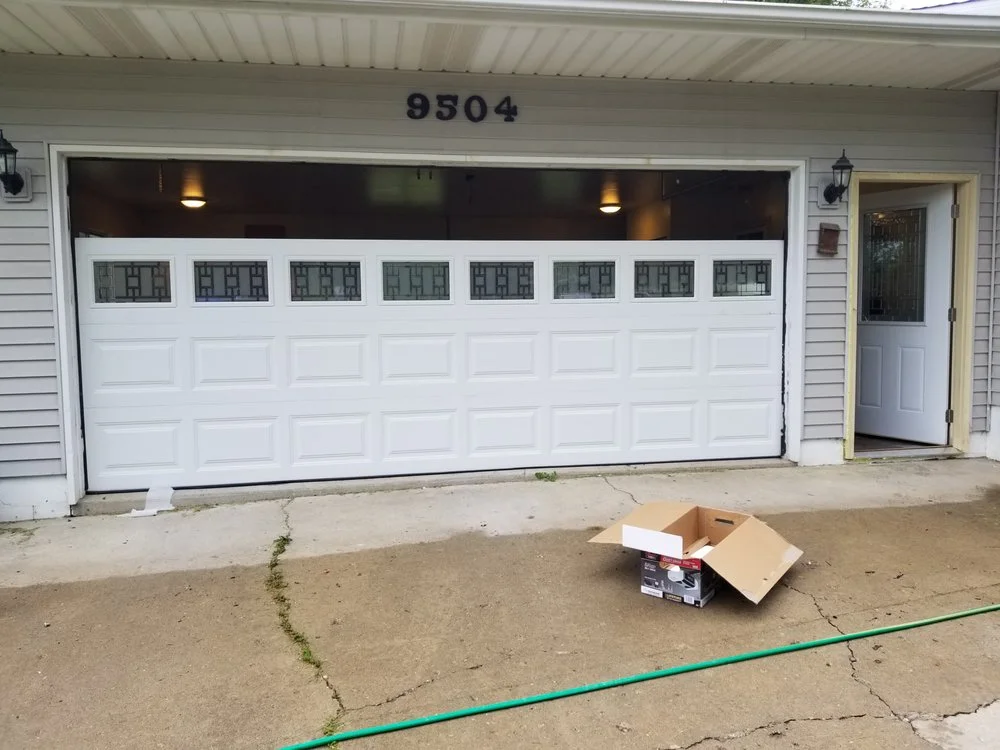White double garage door with Craftsman windows