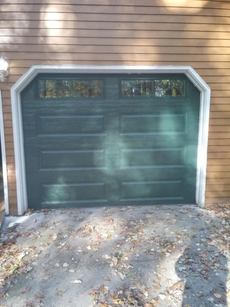 Hunter green garage door with windows