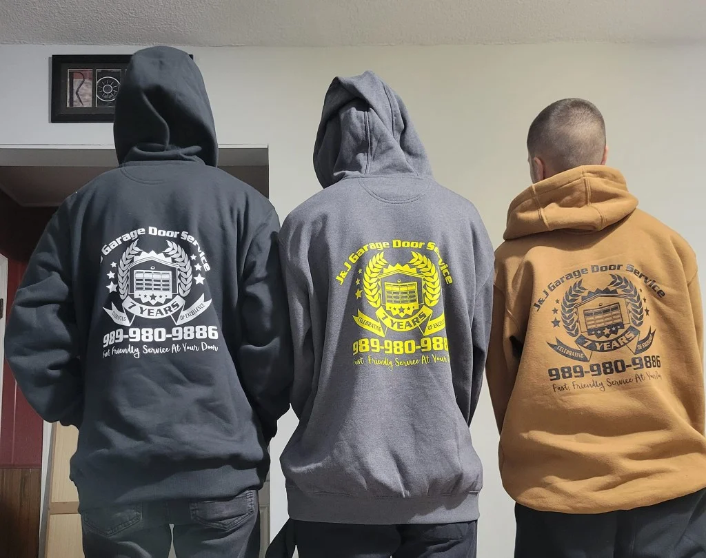 J & J Garage Door Service team wearing company hoodies