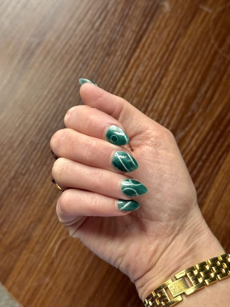 Green marble nail art design at Star Nails & Spa Frankenmuth